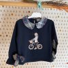 Sudadera azul bici con detalles de cuadros de Mon petit